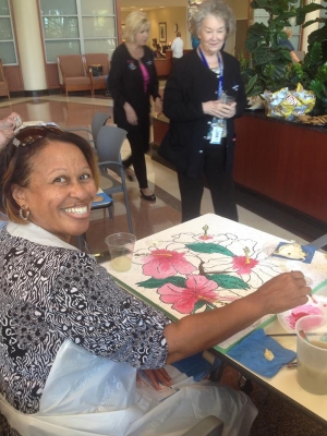 Left, BRG volunteers Viney Samuel and Virginia Alexander enjoy a special activity with Arts in Medicine specialists, including Patti Bailey, pictured.